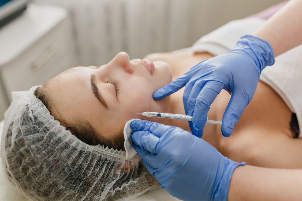 a woman is getting botoc treatment