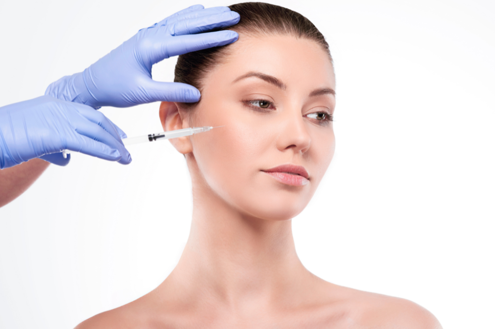 a woman is getting botox treatment